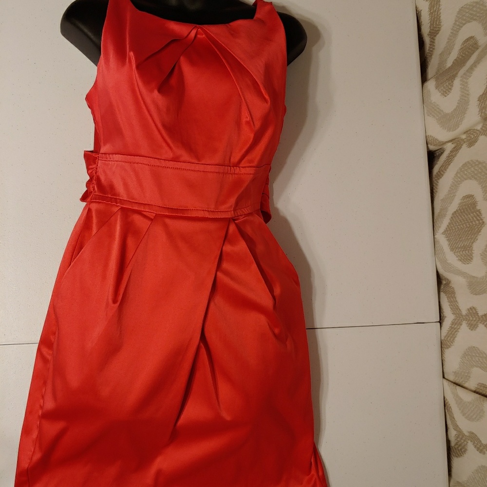 A coral orange colored dress